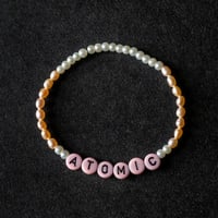 Image 1 of ‘Atomic’ peach pink freshwater pearl bracelet 