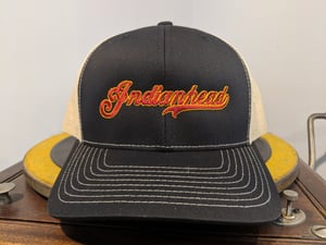 Image of Trucker Hat - Black and Gold/tan with red logo
