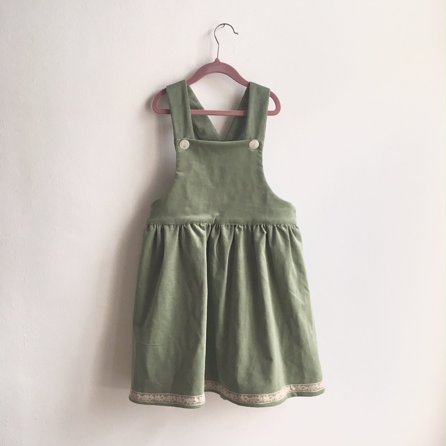 green cord pinafore dress