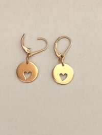 Gold discs with hearts