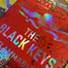 Image of The Black Keys 2019 Rainbow Foil Variant