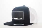 Image of Hoggshit black and white blacked out classic logo trucker cap