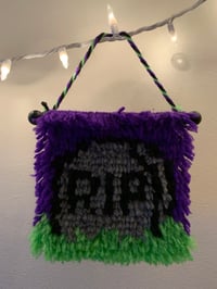 Tombstone wall hanging