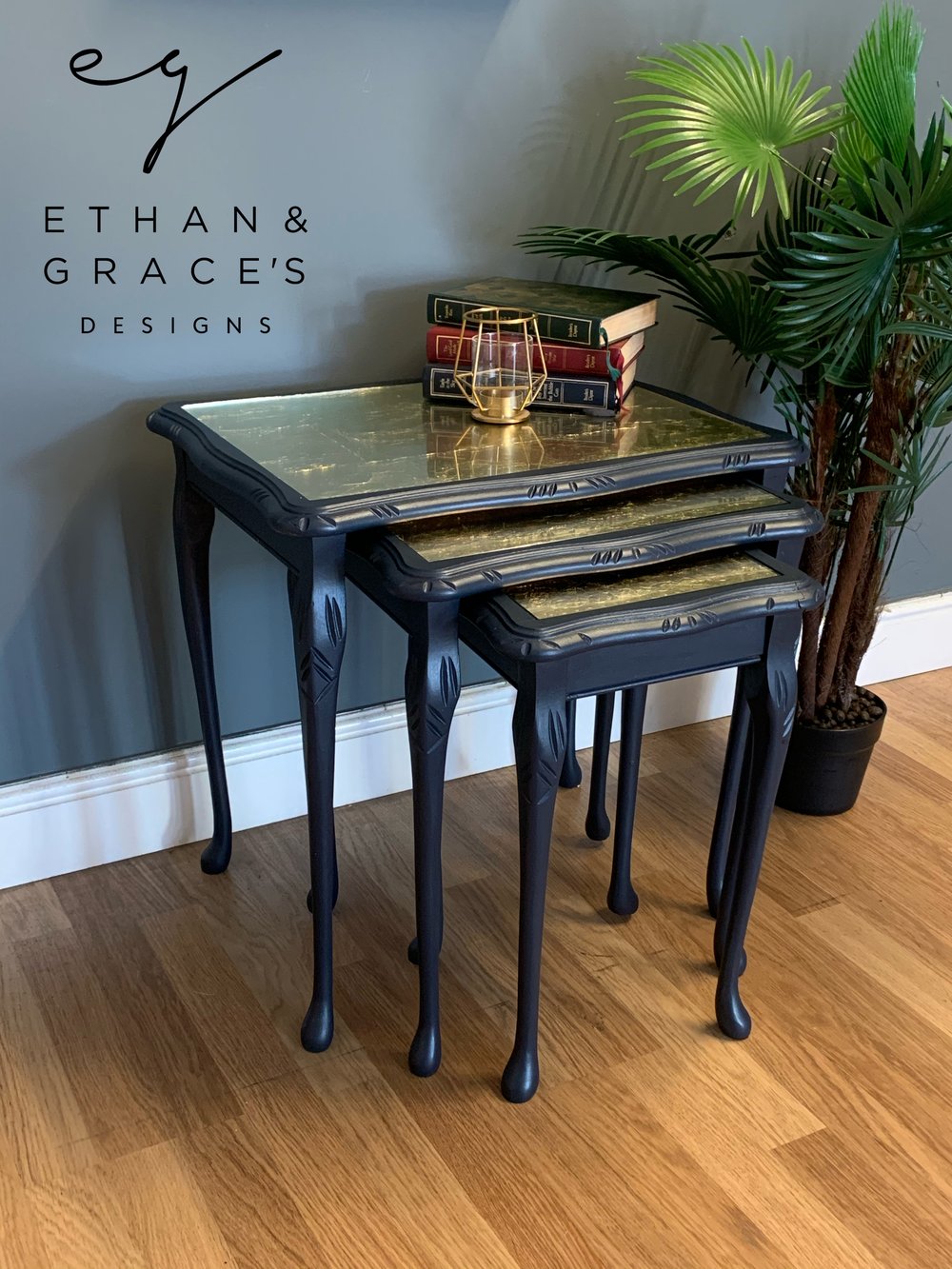 Image of A nest of tables in dark blue & gold leaf.