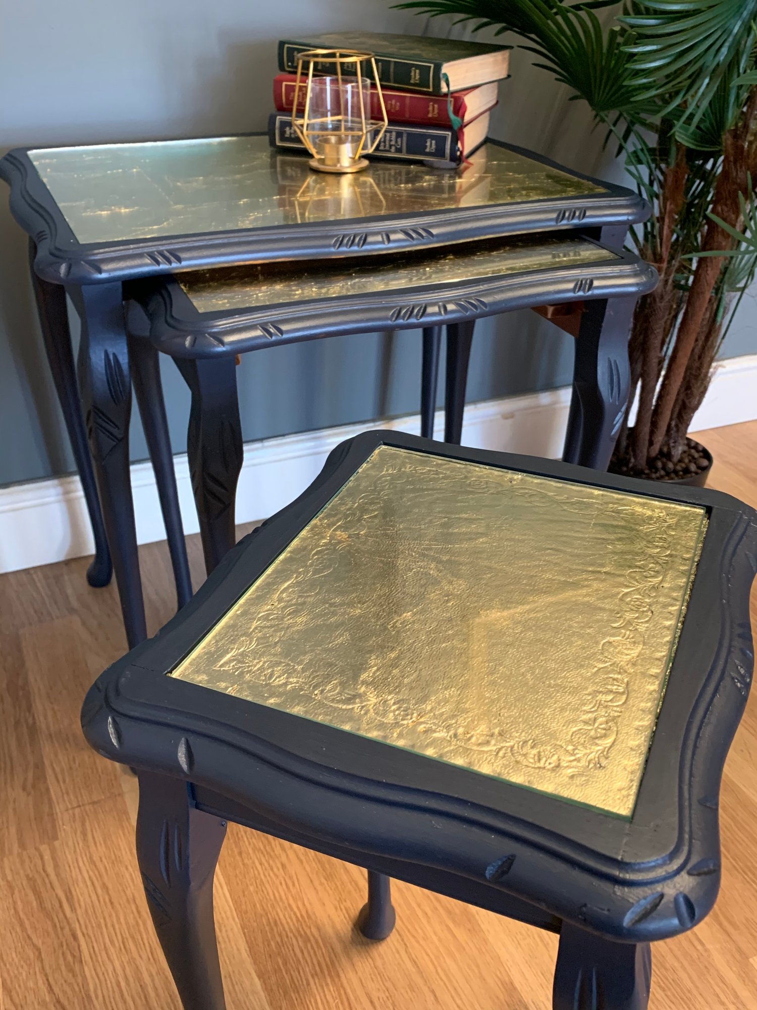 Image of A nest of tables in dark blue & gold leaf.