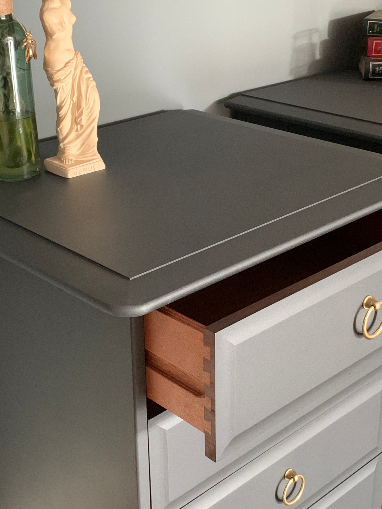 Image of A pair of dark grey stag mahogany bedside tables 