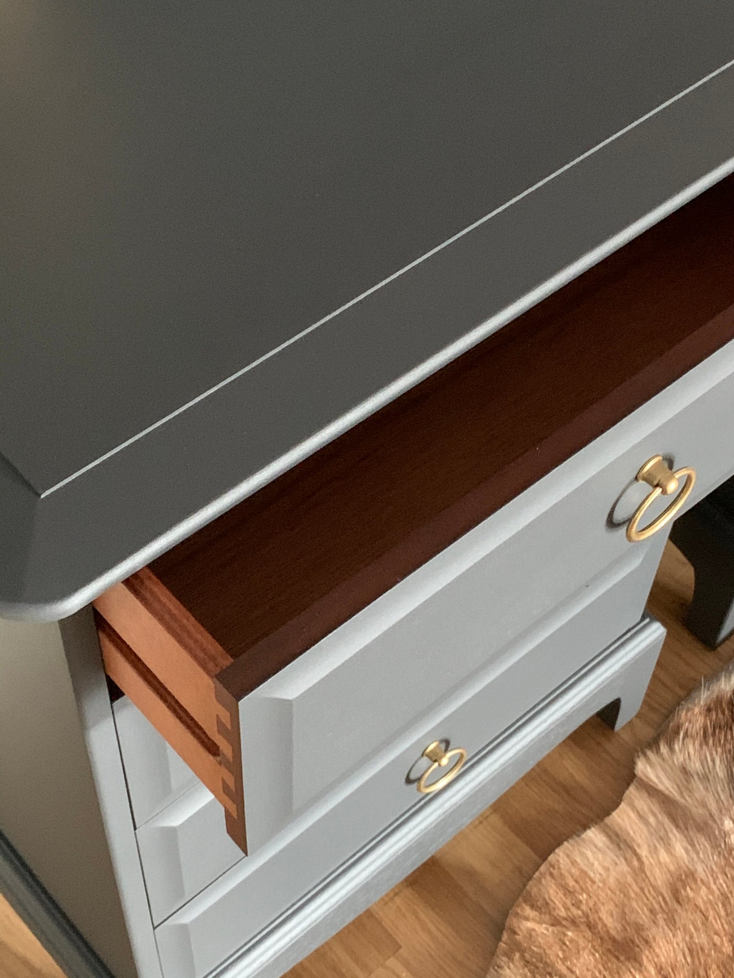 Image of A pair of dark grey stag mahogany bedside tables 