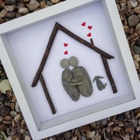 Image 2 of Couple and baby with dog underneath house