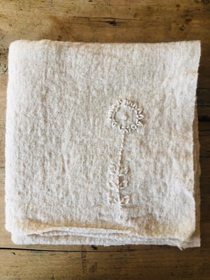 Image of  ecru sunflower embroidered towel 