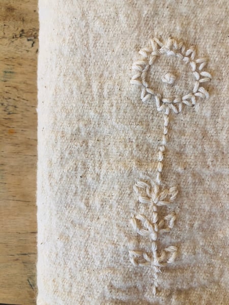 Image of  ecru sunflower embroidered towel 