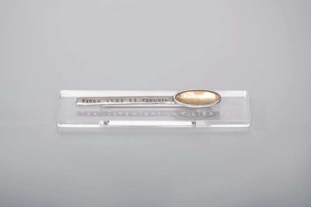 Image of silver brooch with rutile quartz · FIDES VERI ET FIDUCIA ·