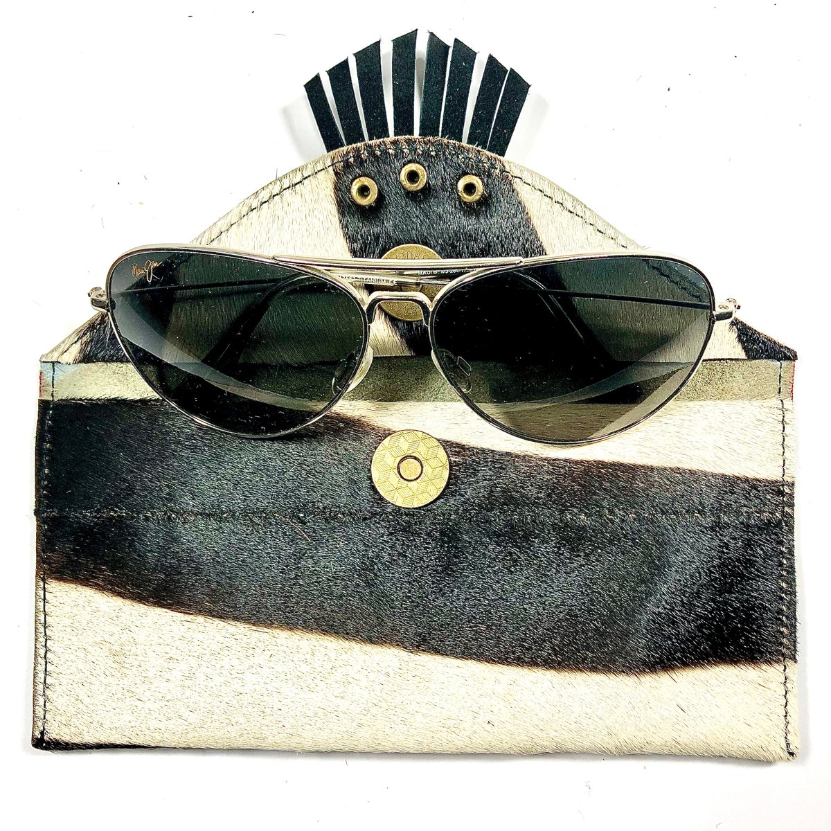 Image of Sunglasses case in zebra fur with fringe