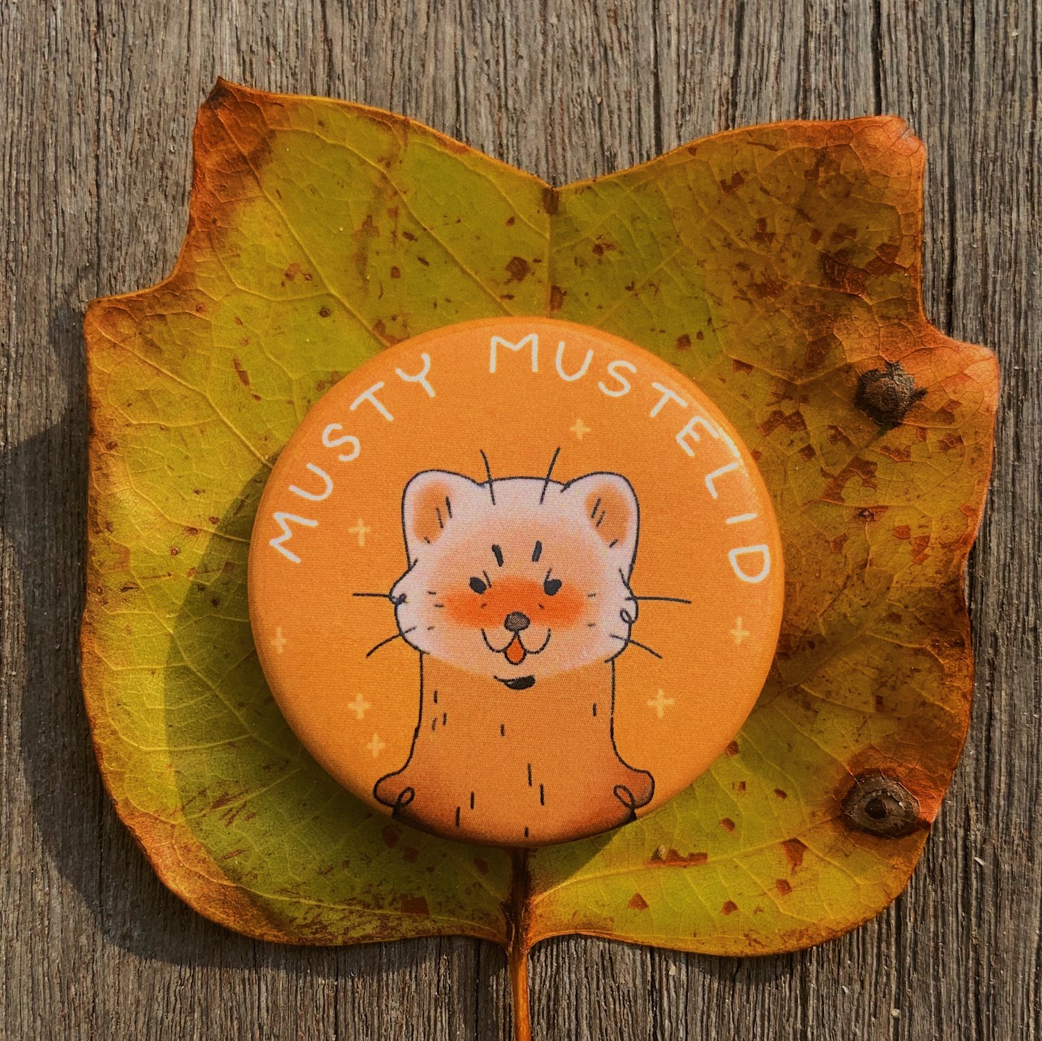musty mustelid button