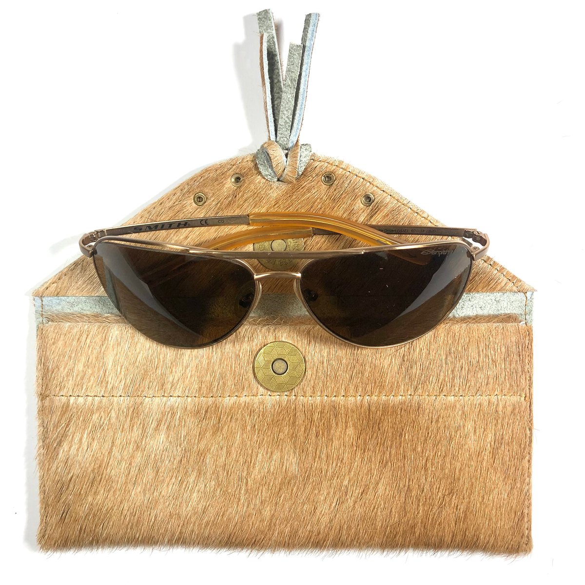 Image of Sunglasses case in tan fur with tassel