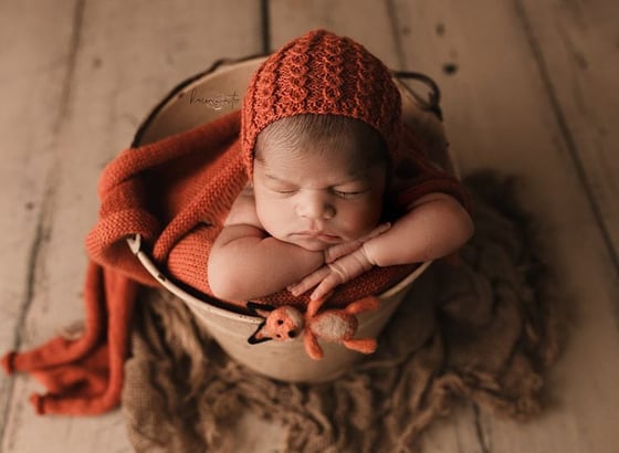 Image of Knit wrap with hat - rust