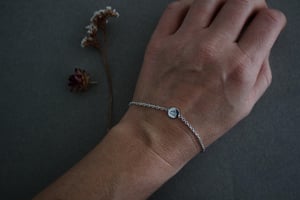 Image of mountains hand engraved little disc bracelet