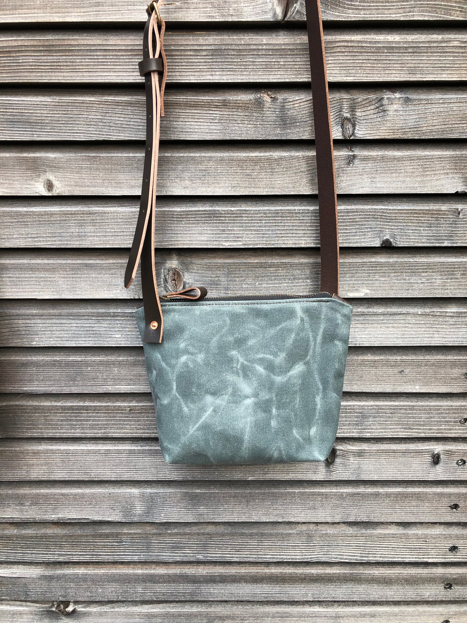 Image of Minimalist day bag in waxed canvas with leather shoulder strap, zipper pouch