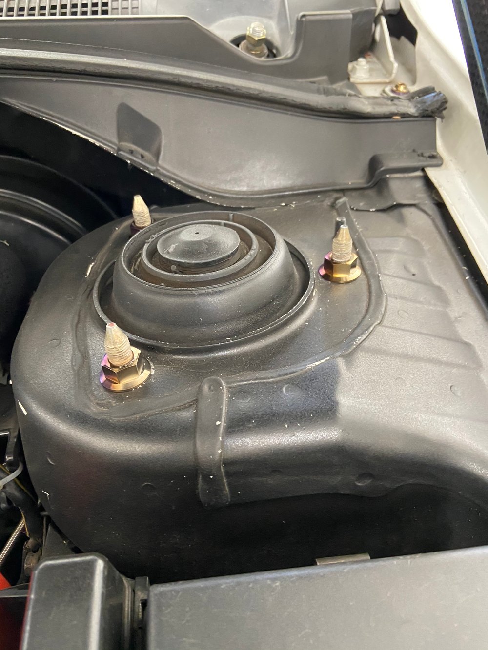 Titanium strut tower nut kit.