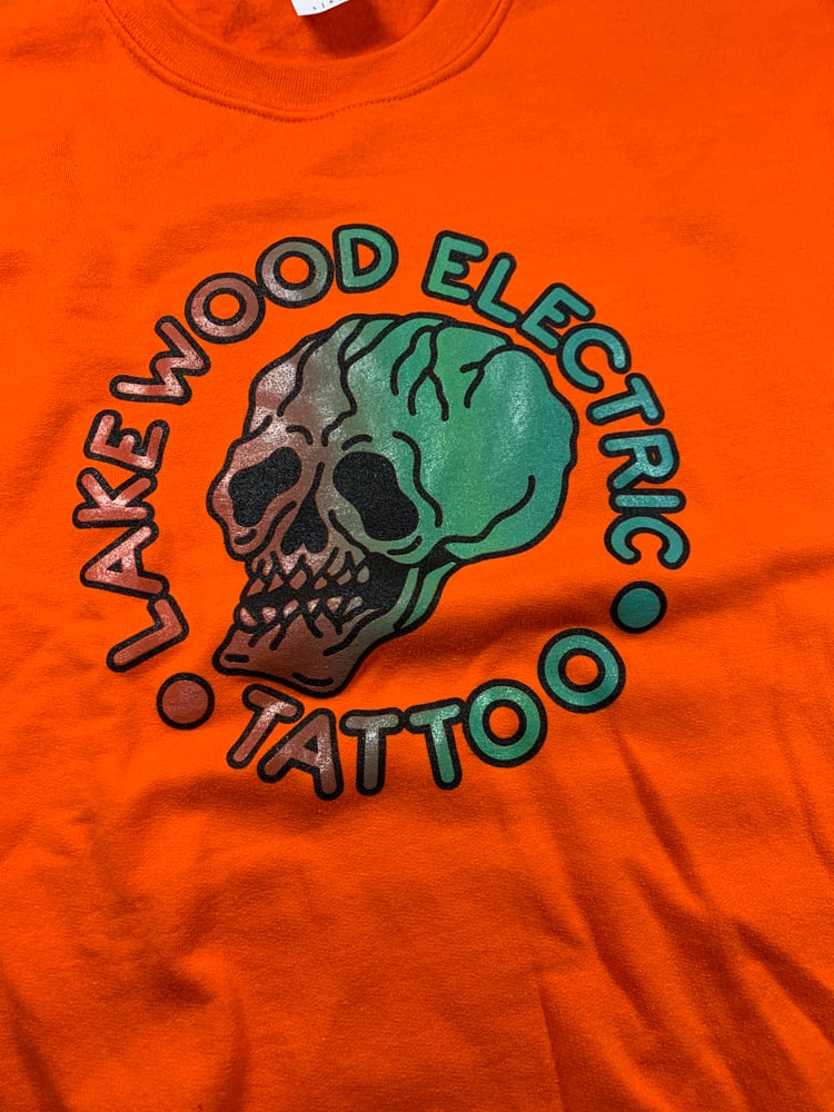 Image of Skull pullover. Bright Orange