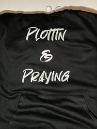 Plottin & Praying  