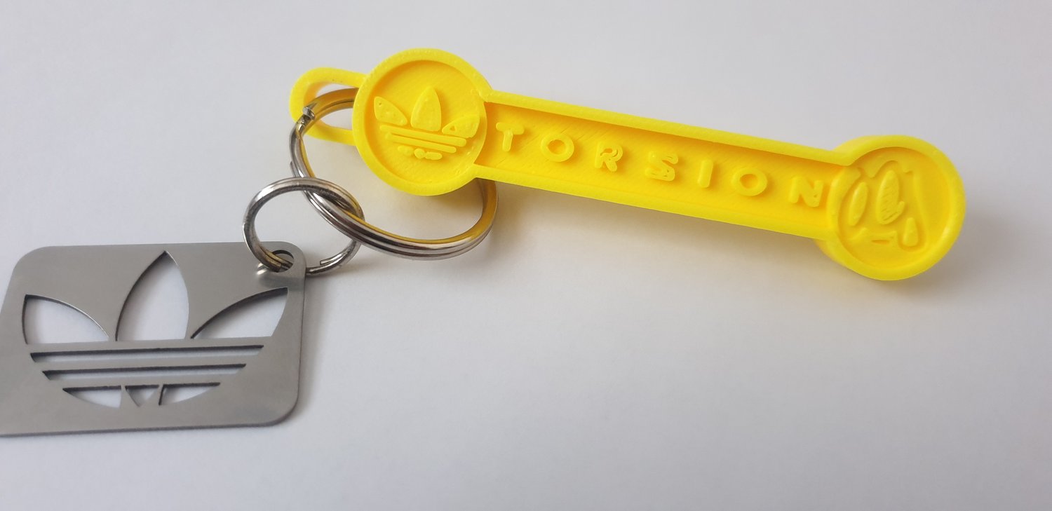 Image of Aqua or yellow torsion bar keyring pre order