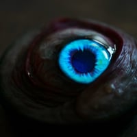 Image 5 of Custom Swappable Phone Grip for smartphones, bright blue reflective pupil, glow in the dark 