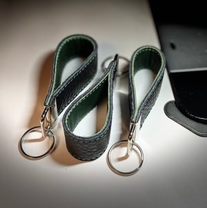 Image of Black and green key chain 