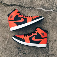 Original 2009 Nike Air Jordan 1 “Max Orange”.