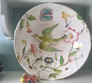 Image of Large Green Bird And flower bowl