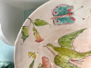 Image of Large Green Bird And flower bowl