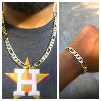 24in gold plated Figaro necklace and bracelet set