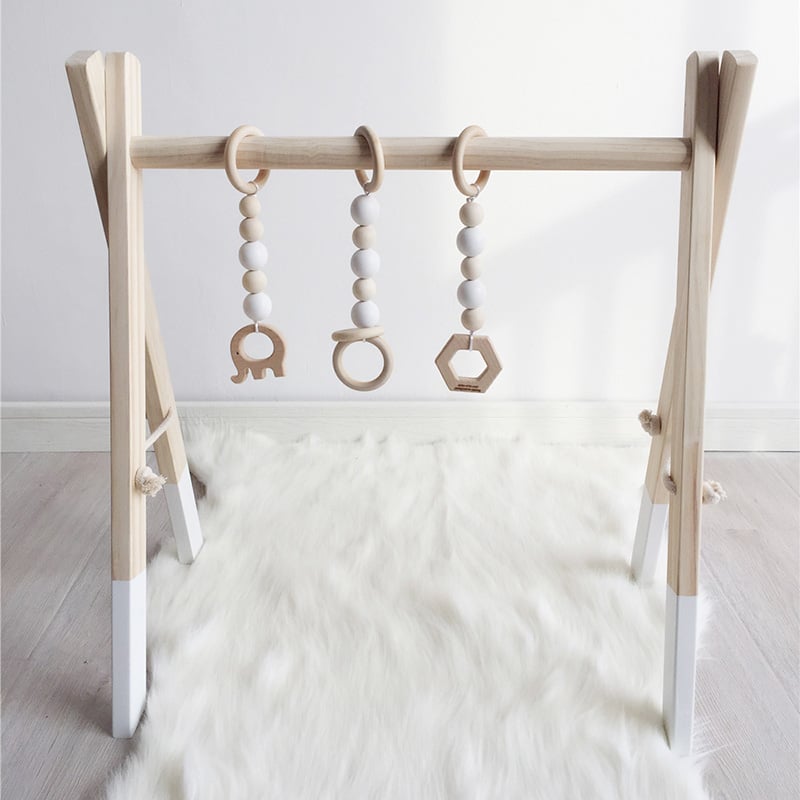 Image of Nordic Wooden Baby Gym With Three Rattles