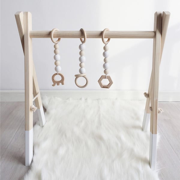 Image of Nordic Wooden Baby Gym With Three Rattles 