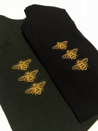 Image 3 of Bee on black shirt