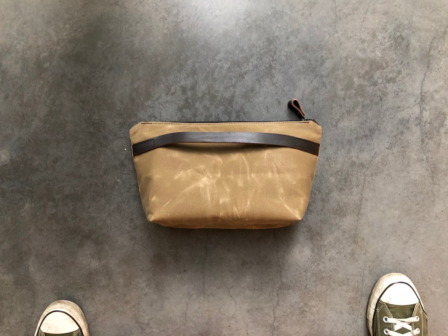 Image of Waxed canvas toiletry bag with luggage handle attachment 