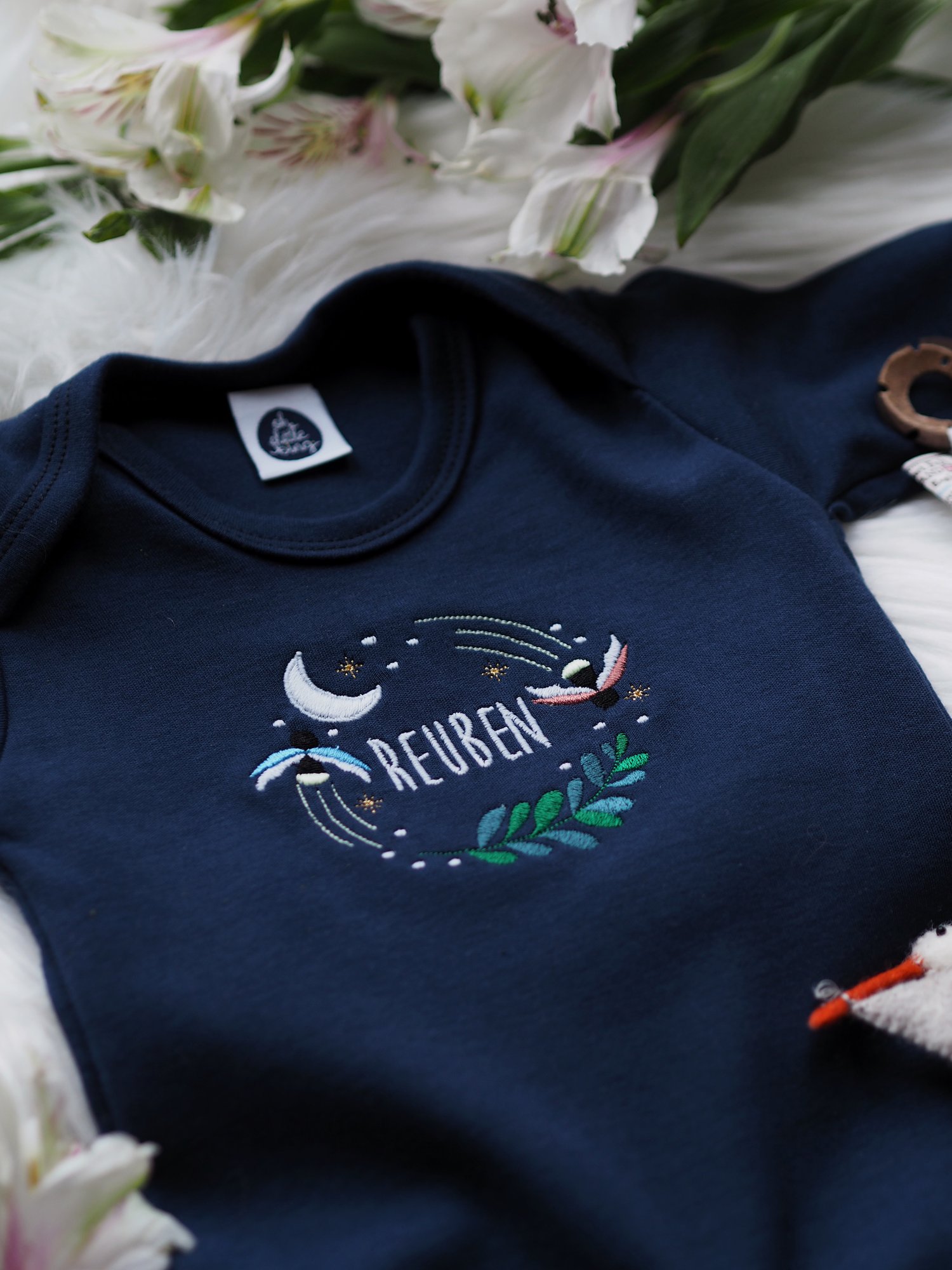 Image of  Fireflies Who Glow In The Dark - Navy baby grow