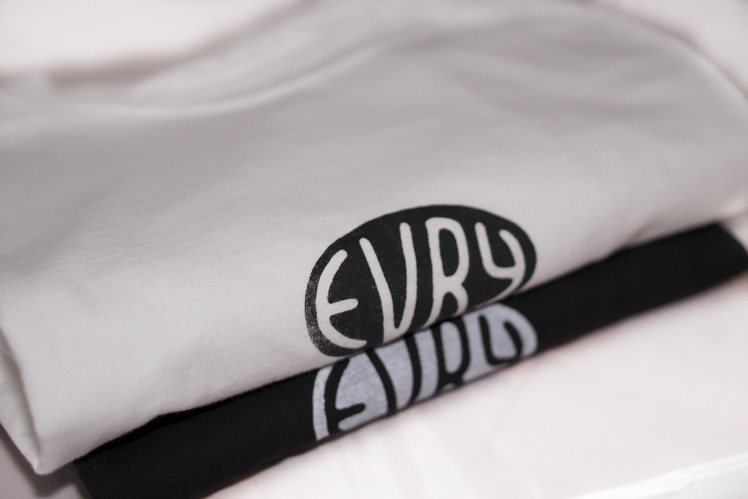 Image of oval "evry" tee