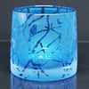 Blue tealight holder with twigs and stars design