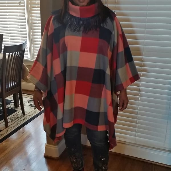 Image of Ostrich trimmed poncho