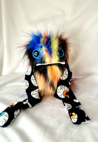 Image 1 of Glow in the dark eye ball Poof