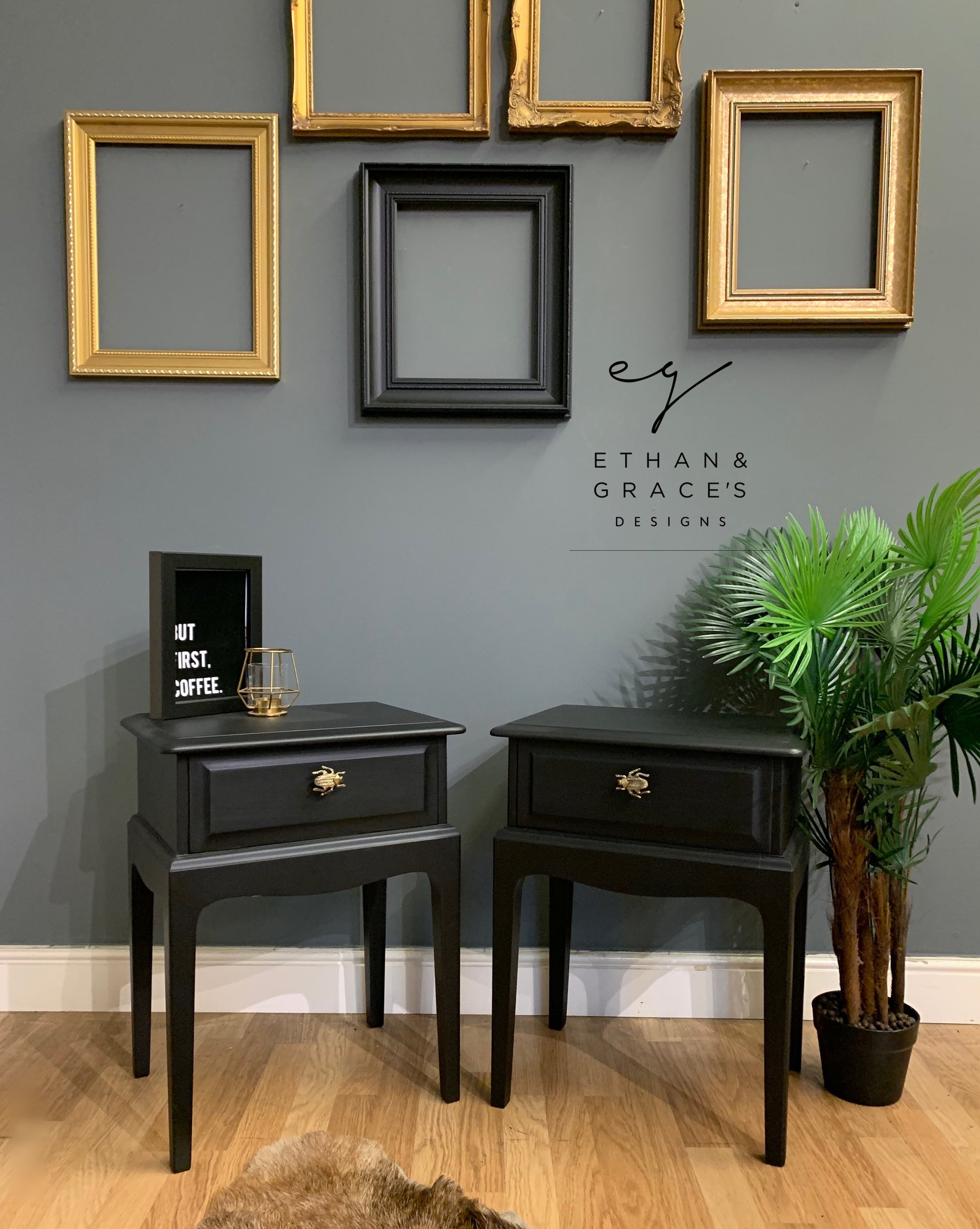 Image of A pair of black stag side tables