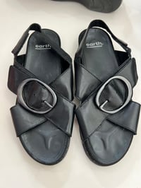 black buckle leather sandals