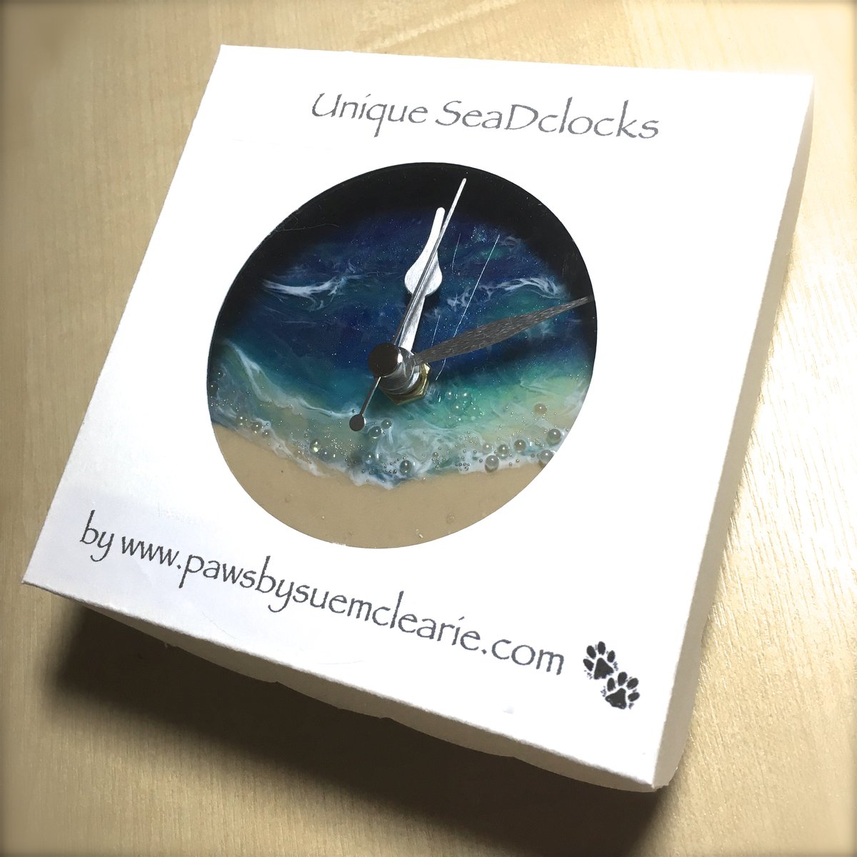 Image of 'Sea-D' shelf clock with stand.