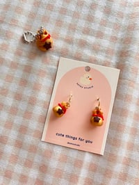 Image 2 of Animal Frosting Money Bag Dangle Earrings