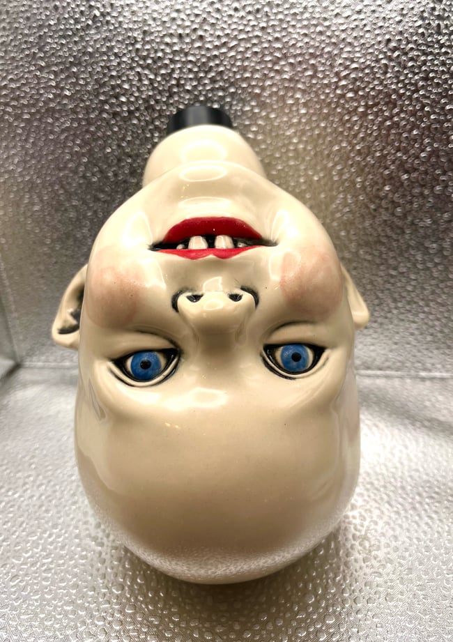 Upside Down Head Vase. 