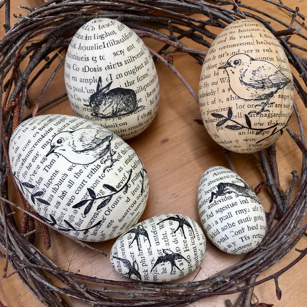 Image of Eggs covered in vintage book paper.