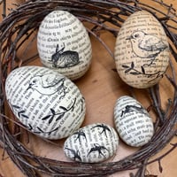 Image 1 of Eggs covered in vintage book paper. 