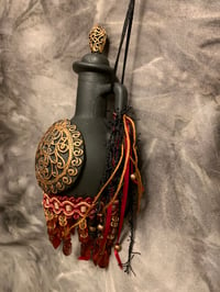 Image 2 of Maroon ,black and copper bottle with fringe and copper accents.