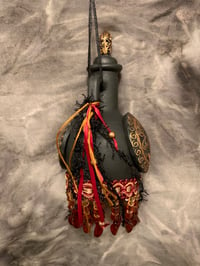 Image 4 of Maroon ,black and copper bottle with fringe and copper accents.