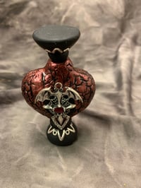 Image 1 of Potion bottle red polymer clay with bat and cross